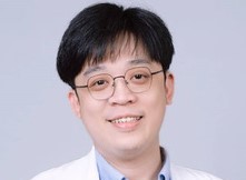 劉